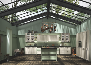 Hera con ante in laccato opaco verde Tè abbinato al legno rovere Moon. Piano di lavoro in quarzo Belgian Grain e in quarzo Bianco Assoluto.